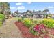 Beautiful backyard with mature landscaping and a patio area perfect for outdoor entertaining at 4738 Southern Trail, Myrtle Beach, SC 29579