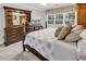 Comfortable bedroom featuring carpet, a large window with a view, and dark-stained furniture at 4738 Southern Trail, Myrtle Beach, SC 29579