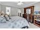 Well-lit bedroom featuring carpet, a large window, a view, and dark-stained furniture at 4738 Southern Trail, Myrtle Beach, SC 29579