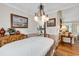 Elegant dining room features a beautiful chandelier, hardwood floors, and views into the kitchen and living room at 4738 Southern Trail, Myrtle Beach, SC 29579