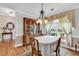 Charming dining room with hardwood floors, and a large window with elegant curtains at 4738 Southern Trail, Myrtle Beach, SC 29579