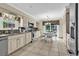 Well-equipped kitchen features stainless appliances, granite countertops, a breakfast nook, and tile flooring at 4738 Southern Trail, Myrtle Beach, SC 29579