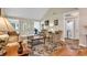 Bright living room features hardwood floors, comfortable seating, and natural light from adjacent rooms at 4738 Southern Trail, Myrtle Beach, SC 29579