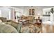 Cozy living room with hardwood floors, neutral walls, comfortable seating, and lots of sunlight at 4738 Southern Trail, Myrtle Beach, SC 29579