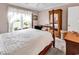 Serene bedroom with plush carpeting, natural lighting, and a classic four-poster bed at 4738 Southern Trail, Myrtle Beach, SC 29579