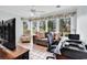 Bright sunroom with tiled floors, wide windows, and peaceful outdoor view at 4738 Southern Trail, Myrtle Beach, SC 29579