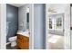 View of bathroom through a bedroom doorway with modern vanity and fixtures at 503 Alston St., Conway, SC 29527