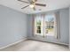 Bright bedroom with neutral paint, ceiling fan, and natural light from large windows at 503 Alston St., Conway, SC 29527