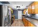 Cozy kitchen with stainless steel appliances, wood cabinets, and laminate flooring at 503 Alston St., Conway, SC 29527