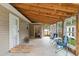 Covered patio features a wood ceiling and a view of the backyard and fenced area at 503 Alston St., Conway, SC 29527