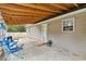 Covered patio area for outdoor relaxing with seating, privacy fence, and fan at 503 Alston St., Conway, SC 29527