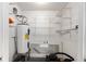 Organized utility room with water heater and shelving for efficient storage solutions at 503 Alston St., Conway, SC 29527