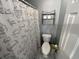 The full bathroom includes a shower and tub combination with a toilet and wall storage at 569 Blue River Ct. # 9-A, Myrtle Beach, SC 29579