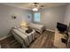 Comfortable bedroom featuring two twin beds, ceiling fan, and dresser at 569 Blue River Ct. # 9-A, Myrtle Beach, SC 29579