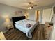 A charming bedroom boasts a ceiling fan, a queen bed, and serene beach themed decorations at 569 Blue River Ct. # 9-A, Myrtle Beach, SC 29579