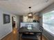 The dining area is complemented by a view of the kitchen and natural light at 569 Blue River Ct. # 9-A, Myrtle Beach, SC 29579