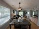 Dining area with wood table, chairs, and open view to the living room at 569 Blue River Ct. # 9-A, Myrtle Beach, SC 29579