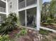 A screened porch provides outdoor enjoyment, surrounded by mature trees and landscaping at 569 Blue River Ct. # 9-A, Myrtle Beach, SC 29579