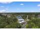 Scenic aerial view of 610 Putters Lane, the community with blue skies and lush green landscaping at 610 Putters Ln. # H-109, Little River, SC 29566