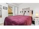 Bedroom features a comfortable queen-sized bed and sliding door to a deck with natural light at 610 Putters Ln. # H-109, Little River, SC 29566