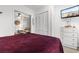 Bedroom features a comfortable queen-sized bed with access to closet and living room at 610 Putters Ln. # H-109, Little River, SC 29566