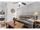 Cozy living room with modern decor, a comfortable couch, and stylish wall art at 610 Putters Ln. # H-109, Little River, SC 29566