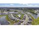 Aerial view of the neighborhood location with community lakes and mature trees at 7037 Grant St., Little River, SC 29566