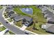 Aerial view of a home with pond, fountain, manicured lawn and gray exterior at 7037 Grant St., Little River, SC 29566