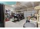 Spacious two car garage featuring a golf cart and ample storage space at 7037 Grant St., Little River, SC 29566