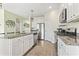 Well-equipped kitchen featuring white cabinets, stainless steel appliances, granite countertops, and a kitchen island at 7037 Grant St., Little River, SC 29566