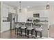 Modern kitchen featuring granite countertops, stainless steel appliances, ample white cabinetry, and a breakfast bar at 7037 Grant St., Little River, SC 29566