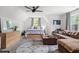Cozy bedroom featuring natural light, a ceiling fan, and a brown sofa at 804 Edisto Ct., Myrtle Beach, SC 29588