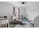 Bedroom filled with natural light, featuring a crib, rocking chair, and geometric rug at 804 Edisto Ct., Myrtle Beach, SC 29588