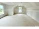 A bedroom under construction with two large windows and a slanted ceiling features natural light at 804 Edisto Ct., Myrtle Beach, SC 29588