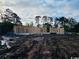 New home construction site showing the framing of the structure and surrounding land at 804 Edisto Ct., Myrtle Beach, SC 29588