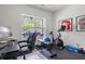 Well-equipped home gym with exercise bike, weights, and large window for natural light at 804 Edisto Ct., Myrtle Beach, SC 29588