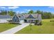 Beautiful home exterior with blue siding, large front yard, long driveway, and a basketball hoop for recreational activities at 804 Edisto Ct., Myrtle Beach, SC 29588