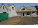 Unfinished house exterior with wrap, windows, and a dumpster in the foreground, indicating an active construction site at 804 Edisto Ct., Myrtle Beach, SC 29588