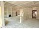 A spacious living room features a fireplace, large windows, and a tray ceiling under construction at 804 Edisto Ct., Myrtle Beach, SC 29588