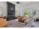 Bright living room featuring a modern fireplace, large windows, comfortable seating, and stylish decor at 804 Edisto Ct., Myrtle Beach, SC 29588