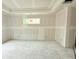 A spacious living room features a large window and a tray ceiling under construction at 804 Edisto Ct., Myrtle Beach, SC 29588
