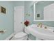 Elegant bathroom featuring a pedestal sink, decorative fixtures, and a beautifully tiled floor at 901 Bear Lake Dr., Longs, SC 29568