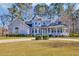 Charming home featuring manicured landscaping and a welcoming wrap-around porch at 901 Bear Lake Dr., Longs, SC 29568