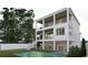 Inviting backyard featuring a refreshing pool, comfortable patio seating, and spacious balconies on a modern three-story home at 914 Perrin Dr., North Myrtle Beach, SC 29582