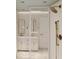 Bathroom featuring double vanities, stylish mirrors, and a glass-enclosed shower with detailed tile work at 914 Perrin Dr., North Myrtle Beach, SC 29582