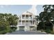 Stately three-story home with multiple balconies, grand columns, and a two-car garage at 914 Perrin Dr., North Myrtle Beach, SC 29582