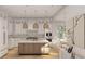 Bright kitchen with white cabinetry, pendant lighting, marble countertops, and an island that adds to its elegance at 914 Perrin Dr., North Myrtle Beach, SC 29582