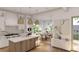 Spacious open kitchen with marble countertops, wooden island, and seamlessly connects to the adjacent dining area at 914 Perrin Dr., North Myrtle Beach, SC 29582