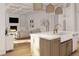Bright kitchen features white cabinets, wood island with apron sink, and seamless access to the cozy living room at 914 Perrin Dr., North Myrtle Beach, SC 29582