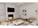 Cozy living room featuring a sleek fireplace, built-in shelving, and stylish modern decor at 914 Perrin Dr., North Myrtle Beach, SC 29582